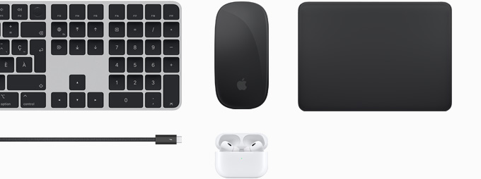 Ensemble d’accessoires réunissant un Magic Keyboard, une Magic Mouse, un Magic Track Pad, un câble Thunderbolt 4 Pro et des AirPods Pro.