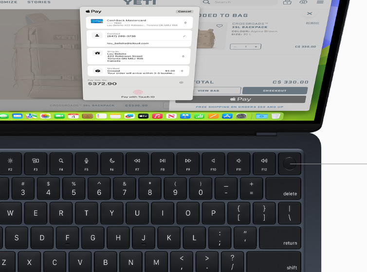 Top view of MacBook Air showcasing Touch ID and Magic Keyboard working with Apple Pay.