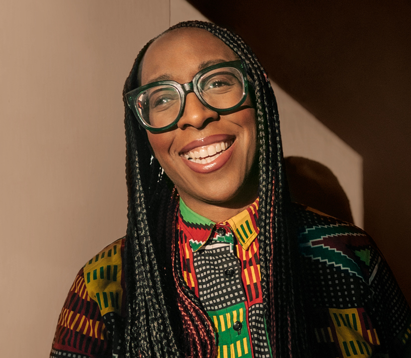 Photo portrait of Shirleena, with a big smile, looking at the reader.