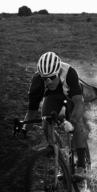 A man biking while wearing Apple Watch Ultra 2.