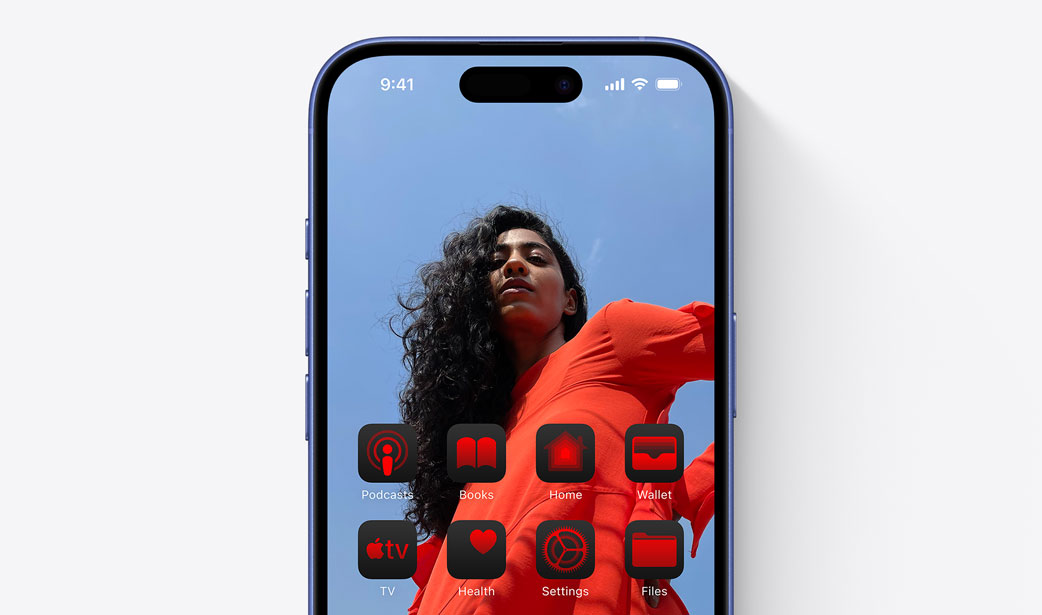 iPhone 16  screen with a photo of a girl in a red dress and widgets tinted a similar color red.