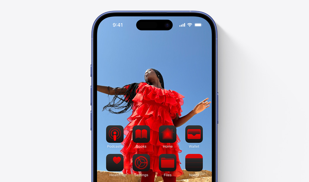 iPhone 16  screen with a photo of a girl in a red dress and widgets tinted a similar color red.