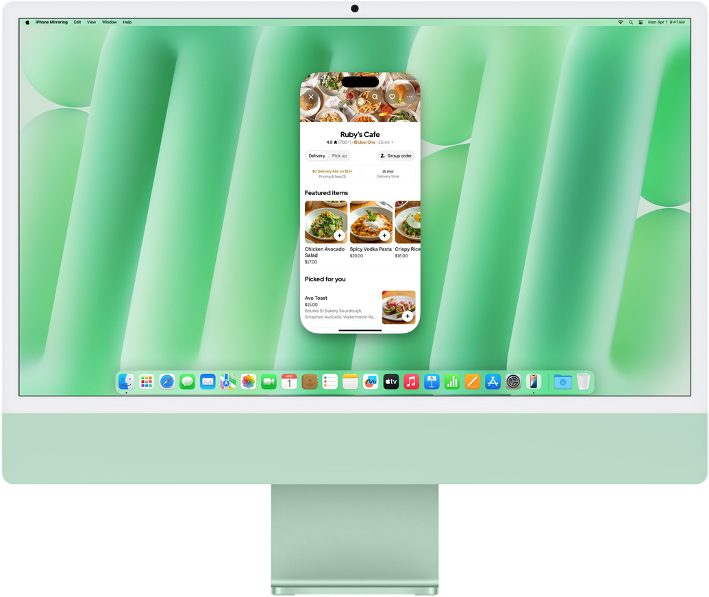 iPhone 鏡像輸出功能展示。顯示 Uber Eats app 的 iPhone 螢幕，在 iMac 上鏡像輸出並操作。