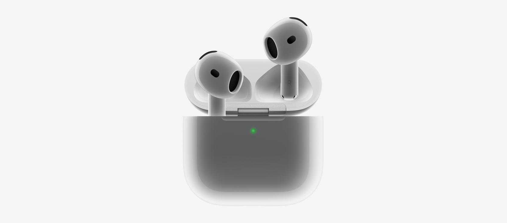 AirPods 4 som plasseres i ladeetuiet.