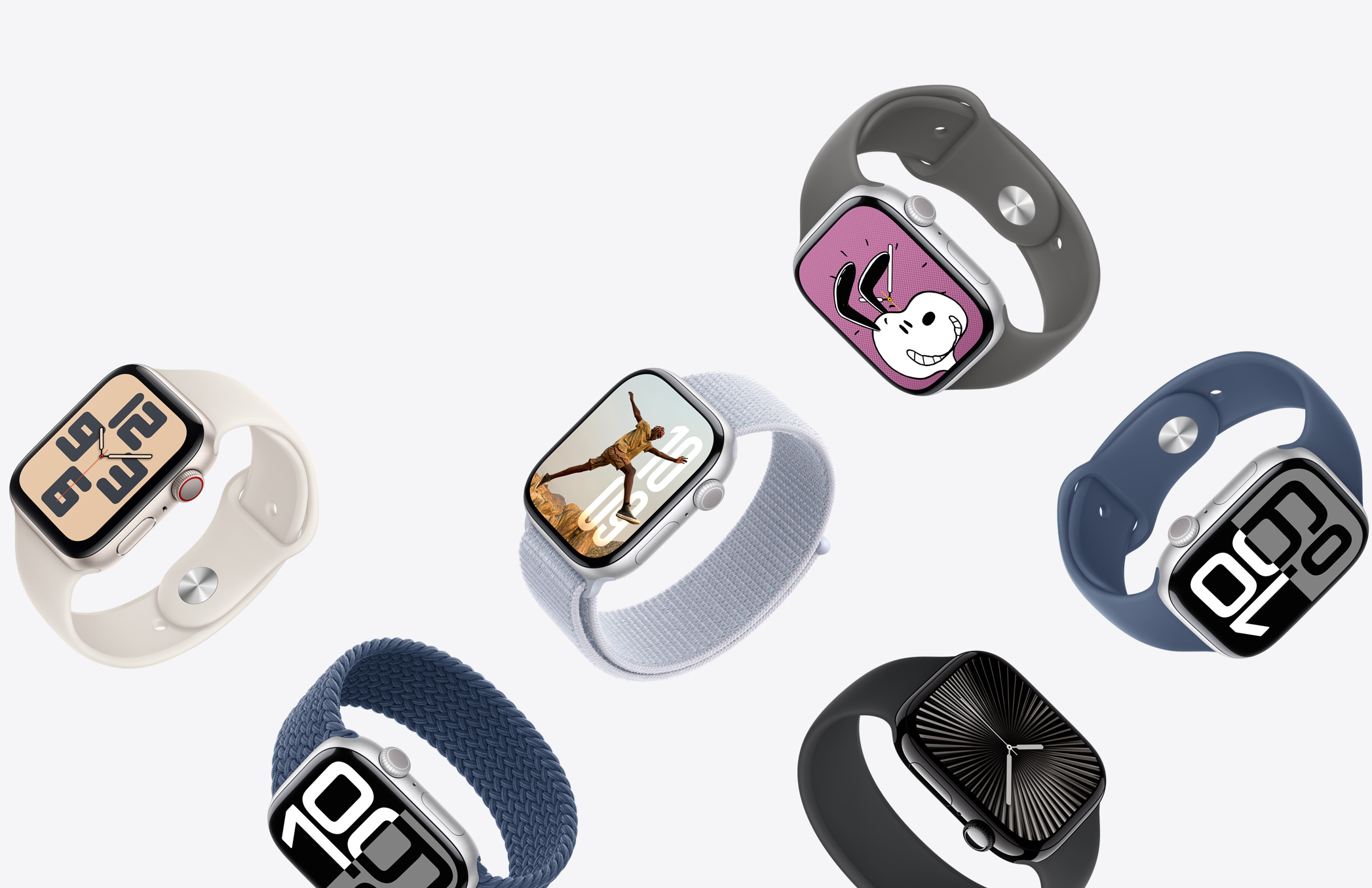 A selection of Apple Watch devices with different case finishes and a variety of band colors and materials.